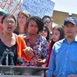 One Word Is Reshaping Michigan’s Race Rashida Tlaib speaks at a podium with Ayanna Pressley and Joaquín Castro beside her; Pete Aguilar behind