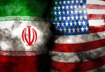 War’s Endgame Teased – Or Escalation? Iran and United States flags with smoky overlay