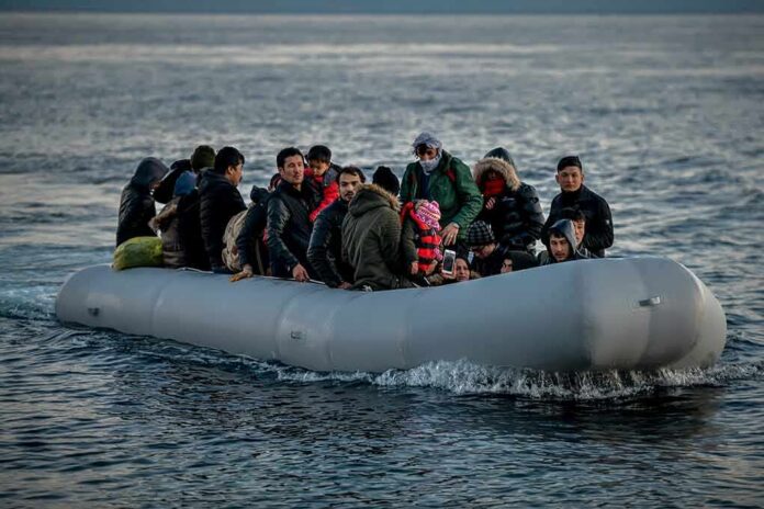 shutterstock_1661385781 Group of people in an inflatable boat on open water