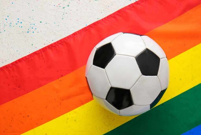 shutterstock_1968051898 Soccer ball on a rainbow flag