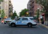 NYPD police SUV blocking a city street at a taped-off scene