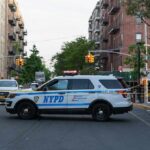 Fifth Avenue Road Rage Turns Bloody NYPD police SUV blocking a city street at a taped-off scene