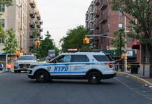 Fifth Avenue Road Rage Turns Bloody NYPD police SUV blocking a city street at a taped-off scene