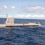 Underwater Snag Exposes Control Gaps Submarine cruising on calm ocean surface