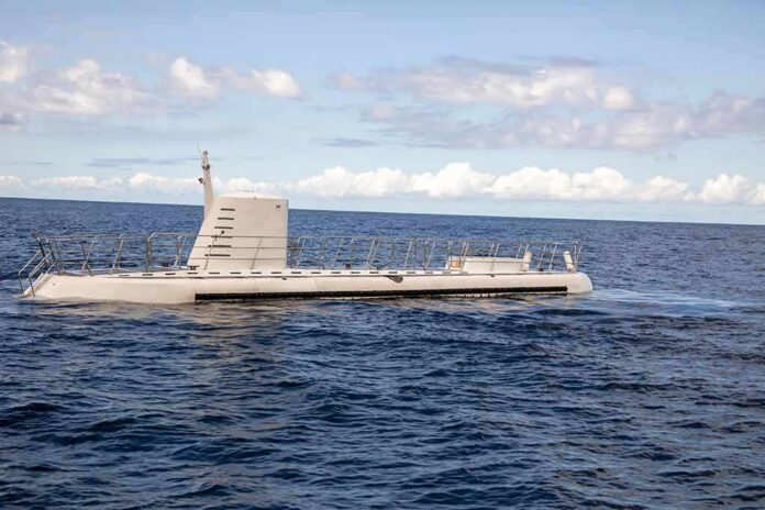 shutterstock_2044480136 Submarine cruising on calm ocean surface
