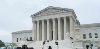 U.S. Supreme Court building with media equipment set up outside