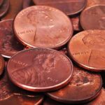 Congress Axes Penny – What Rounds Up? pile of copper pennies with heads side up
