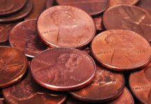 Congress Axes Penny – What Rounds Up? pile of copper pennies with heads side up