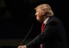 Trump Torches Globalism at the UN Donald Trump speaking at a podium in profile against a dark background