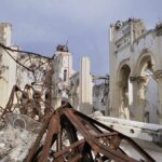 47 Murdered in Church Massacre Interior view of a destroyed building with collapsed arches and debris