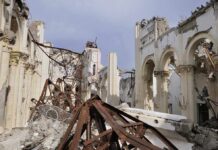 47 Murdered in Church Massacre Interior view of a destroyed building with collapsed arches and debris