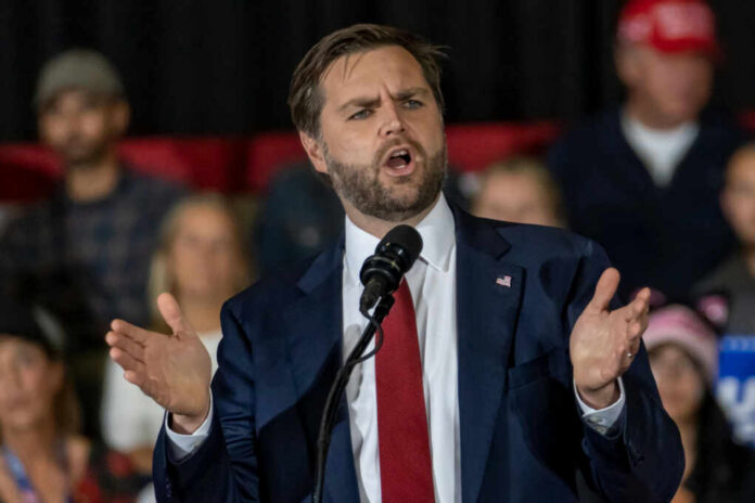 54801cb8-0515-4c34-a2d8-f79705e6683e_shutterstock2542628059jpg.jpeg Man in suit speaking at a podium
