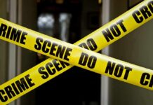 Five Missing Women Feared Dead Yellow crime scene tape crossing a doorway