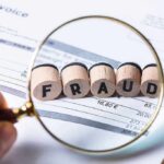 Ilhan Link Triggers Explosive Fraud Uproar Magnifying glass highlighting wooden blocks spelling fraud on an invoice