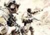 Combat Cash Spike After 24 Years Soldiers in camouflage gear with rifles in a sandy terrain