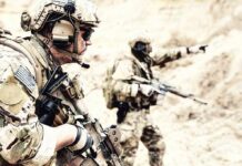 Combat Cash Spike After 24 Years Soldiers in camouflage gear with rifles in a sandy terrain