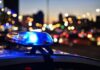 Stadium Panic After Targeted Shooting Police car light bar flashing at dusk