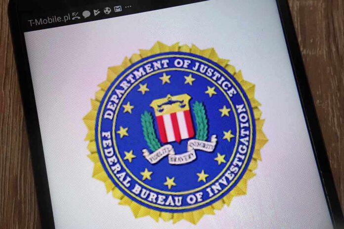 shutterstock_1170165781 FBI seal displayed on a smartphone screen