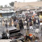 Rescuers Pull Kids From Rubble Crowd gathers at a market after a vehicle explosion