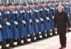 Shadow Deal Frees American – What’s Hidden? Vladimir Putin walks past an honor guard; Genaro García Luna and Darius Kilgo not visible