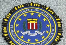 Bank Robber’s Bizarre Comeback FBI emblem on a stone surface