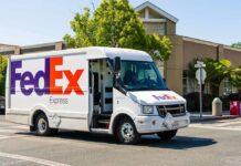 FedEx’s Risky Cargo Fight Escalates FedEx delivery truck driving on a city street
