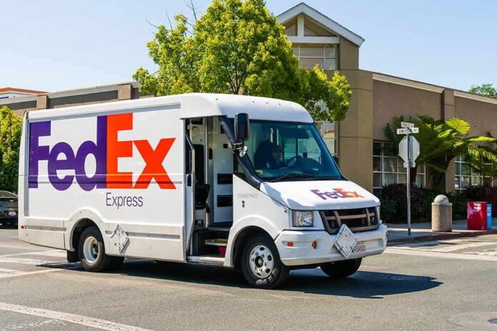 FedEx delivery truck driving on a city street