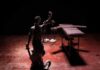 Execution Drama Returns To Texas Lady Justice statue with scales in dramatic light beside an empty gurney