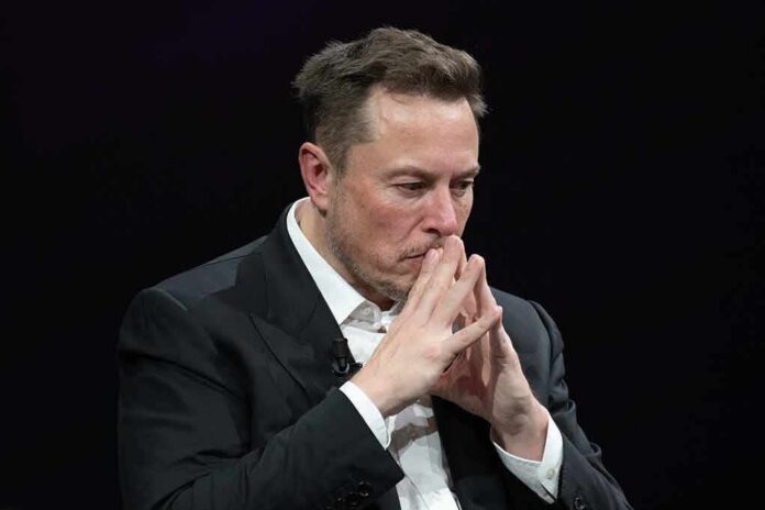 Elon Musk seated with hands steepled in thought