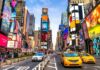 Times Square street with yellow taxis and bright billboards