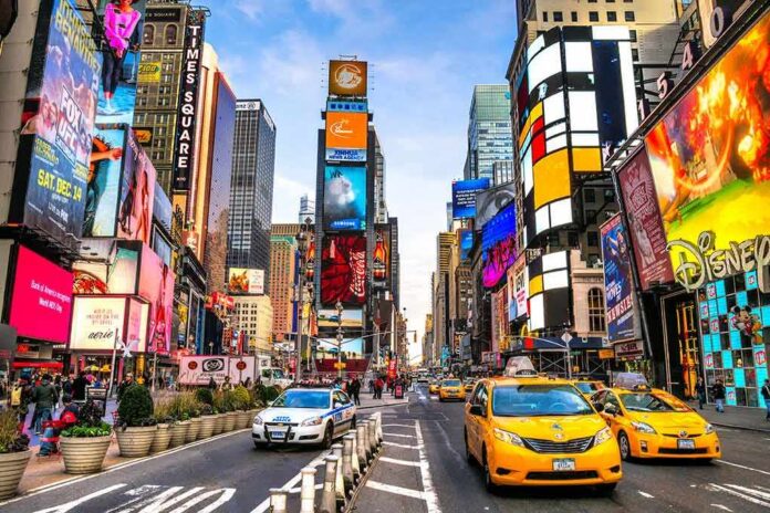 shutterstock_248799484 Times Square street with yellow taxis and bright billboards