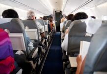 Rogue Pilot Stopped Mid-Plunge Airplane cabin with passengers seated in rows
