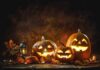 Jack-o'-lantern pumpkins glowing on a rustic table