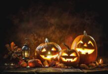 Outrage Erupts Over Hanging Bodies Display Jack-o'-lantern pumpkins glowing on a rustic table